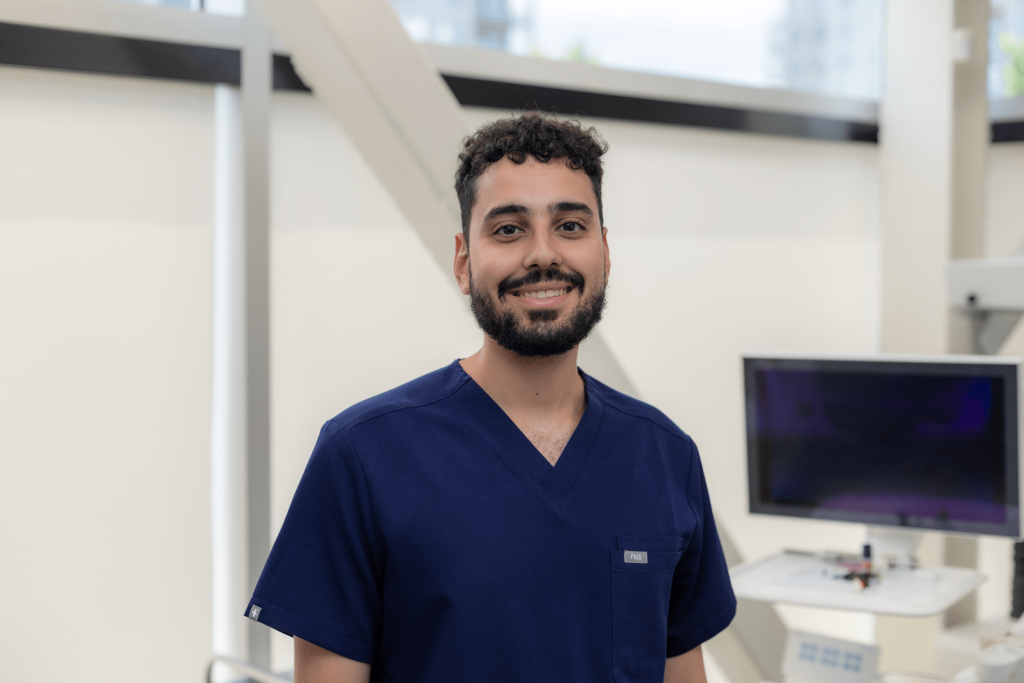 A picture of a smiling dentist.